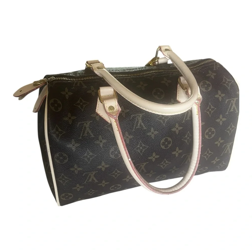 Louis Vuitton Speedy bag in monogram canvas with cream trim. - Picture 5 of 10